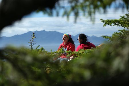 Veronica Arrants and Breanna Miethe pick berries. (National Geographic/Wayne Moss)