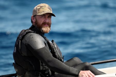 Aldo Kane sits in a kayak on the ocean. (National Geographic/Mario Tadinac)