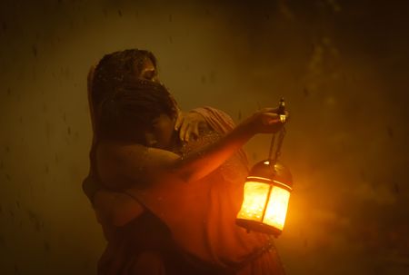 Avianius, played by Frankie Treadaway, and his mother Claudia, played by Madeleine Walker, embrace in the dark, ash-clogged street of Pompeii. (National Geographic/Darrin Zammit Lupi)