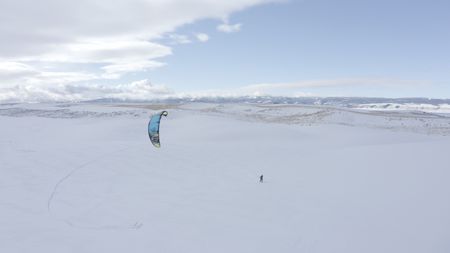 Sarah-McNair Landry Kite Skiing.   (photo credit: National Geographic /Ross McDonnell)