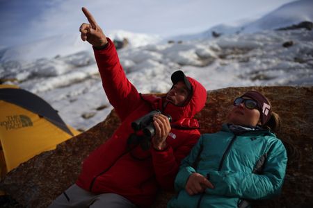 Alex Honnold and Hazel Findley look up at the Pool Wall.  (photo credit: National Geographic/JJ Kelley)