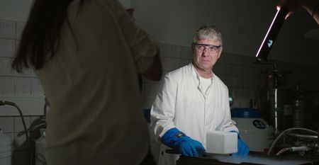 Thomas Hildebrant looks serious while photographer Ami Vitale captures the moment  at the  BioRescue lab in Berlin, Germany   (credit: National Geographic)