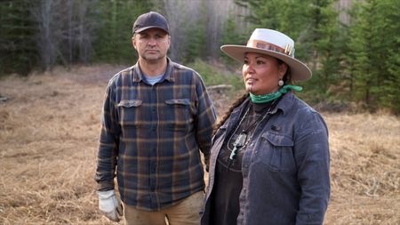 Jody Potts-Joseph and her husband Jamey Joseph look at the Yukon River spring break-up damage caused by the ice. (National Geographic)
