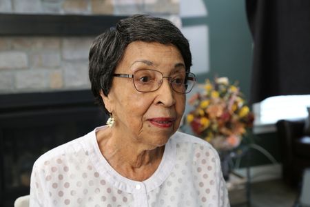 Joann Woodson, wife of Waverly Woodson Jr., poses for a portrait at her son Stephen Woodson's home in Frederick, Md. Waverly Woodson Jr. was a combat medic who served with the 320th Barrage Balloon Battalion on D-Day. (National Geographic/Shianne Brown)