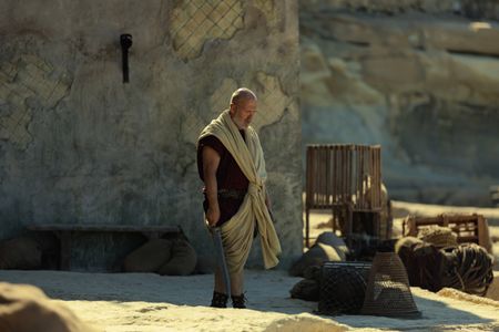 The Praetorian, played by Barry Aird, walks towards the sea at Herculaneum, trailing his sword in his right hand. (National Geographic/Darrin Zammit Lupi)