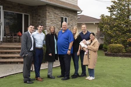 The D'Allara family and the Spade family pose together during their reunion. (National Geographic/Virginia Sherwood)