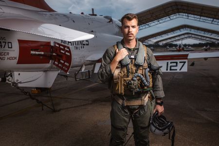 Student 1st Lt Chuck Kent poses behind a T-45. (Credit: National Geographic/Freddie Claire)