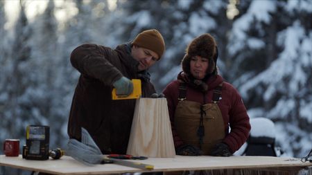 Jamey Joseph and Jody Potts-Joseph bait and prepare marten traps. (National Geographic)
