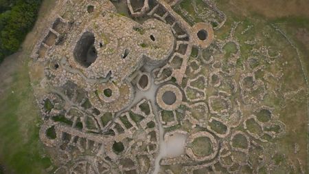 TUCCI IN ITALY - “Sardinia” - Aerial view of "Su Nuraxi", the Nuragic archaeological site in Barumini, Sardinia. (National Geographic)TUCCI IN ITALY