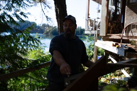 Carl Hernandez helps construct a ramp on his neighbor's property. (National Geographic/Mickey Ramos)