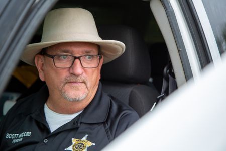 Coroner Scott McCord in his car. (National Geographic/Tom Beard)