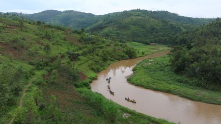 An team paddles down the Kagera River, collecting data on the health of the river. (National Geographic)