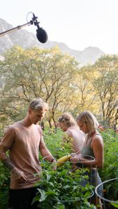 Johnny Collinson, Deb Collinson, and Angel Collinson tend to the family garden.  (National Geographic/Elena Gaby)