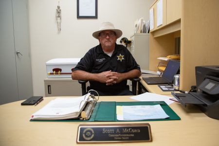 Coroner Scott McCord at his desk. (National Geographic/Tom Beard)