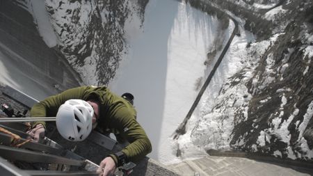 Chris has pushed himself through one of the hardest challenges he's ever faced - climbing the tallest permanent artificial climbing wall in the world, on the Luzzone dam in Switzerland.  (Credit: National Geographic)