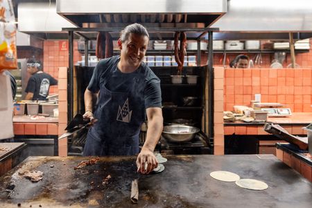 Santiago Muñoz, chef at Maizajo, makes heirloom corn tortillas. (National Geographic/Alicia Vera)