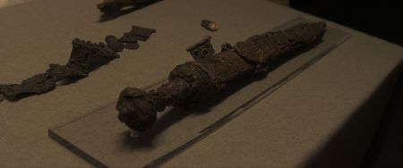 The Praetorian's sword and belt, which was excavated on the beach of Herculaneum, on a  table in the archaeological relics storage at Herculaneum Archaeological Park. (National Geographic)