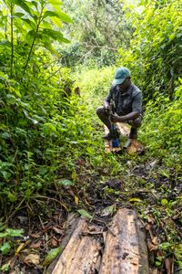Emmanuel Niyonkuru tests the turbidity and oxygen levels of the source water using an Aquatrol. (National Geographic/Philip Jones)