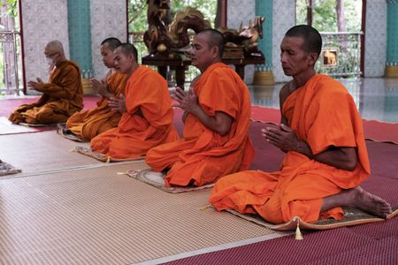 Monks pray in a temple in Mae Sot, Thailand. (National Geographic)