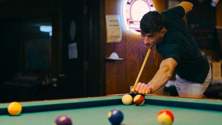 Student 1st Lt Austin Claggett shooting pool. (Credit: National Geographic)