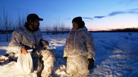 Tig Strassburg and his son, Evan, successful after a waterfowl hunt. (National Geographic)