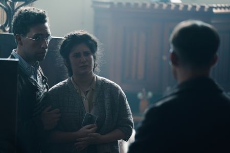 A SMALL LIGHT - Isaac and Maya Schwarz, played by Dylan Edwards and Sarah T. Cohen, speak with Jan, played by Joe Cole, about their son as seen in A SMALL LIGHT. (Credit: National Geographic for Disney/Martin Mlaka)