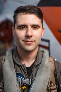 Student LTJG Marcus Figueroa poses next to a T-45. (Credit: National Geographic/Freddie Claire)