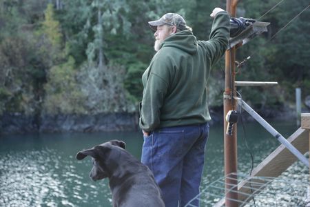 Tim 'Curly' Leach uses a hoist to get a deer up to his property. (National Geographic/Mickey Ramos)
