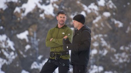 At the base of the Luzzone dam, in Switzerland, Chris and motocross stunt rider Robbie Maddison talk through the climbing route.  (Credit: National Geographic)
