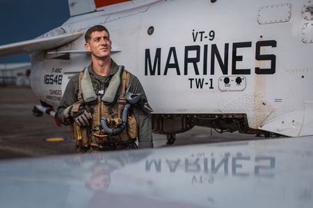 Student 1st LT Austin Claggett poses next to a T-45. (Credit: National Geographic/Freddie Claire)