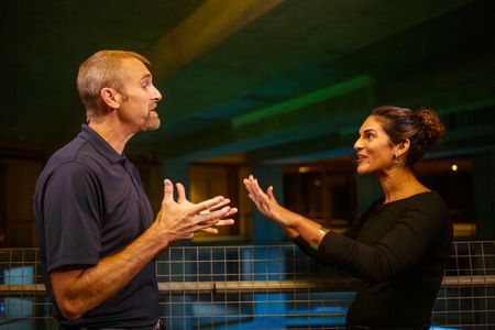 Mike Heithaus and Diva Amon discussing how great white sharks scavenge on whale carcasses during a take at the studio lab shoot. (National Geographic/Aubrey Fagon)