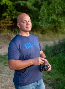 Sergeant Bryan Johnson of Stark County Sheriff's Office fishing at Canal Fulton. (National Geographic/Rob Taylor)