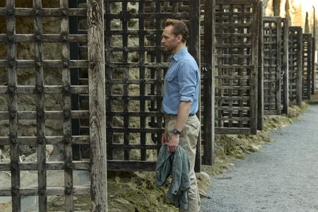 Tom Hiddleston looks into the boat sheds at Herculaneum, where roughly 300 human remains were uncovered upon excavation of the site. (National Geographic/Paolo Verzone)
