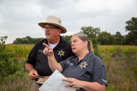 Coroner Scott McCord and Chief Deputy Heidi McCord return to the site where the body was discovered in 1983. (National Geographic/Tom Beard)
