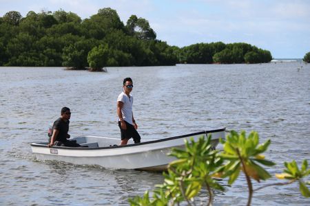 Dr. Albert Lin approaches the ancient island city of Nan Madol by boat. (National Geographic/Blakeway Productions)