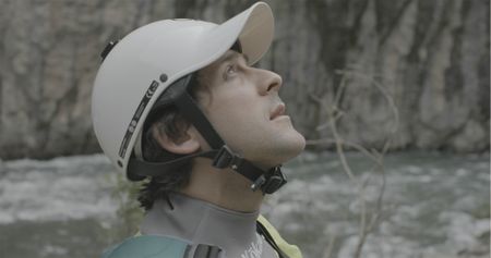 Gerd Serrasolses looks up at the sky in his kayaking helmet.  (National Geographic/Gene Gallerano)