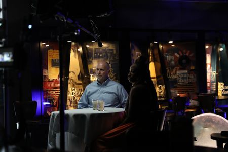 BLACK TRAVEL ACROSS AMERICA - Bradley Wolf and Martinique Lewis take direction from the Producers in preparation for their interview. (National Geographic for Disney/Victoria Donfor)