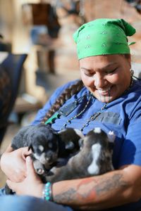 Jody Potts-Joseph with her puppies. (National Geographic/Ashton Hurlburt)