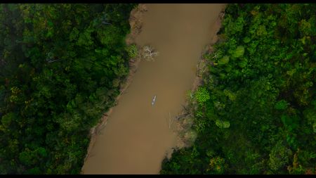 Will Smith canoes down river on the Amazon with Expedition Leaders Bryan Fry and Carla Perez to Bameno. (credit: National Geographic)