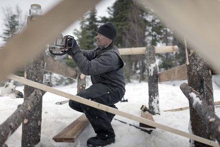 Joel Jacko builds a dock in the winter season. (National Geographic/Wayne Shockey)