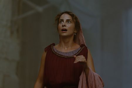 Claudia, played by Madeleine Walker, looks up at the eruption column of Vesuvius, her eyes wide in horror and fear. (National Geographic/Darrin Zammit Lupi)