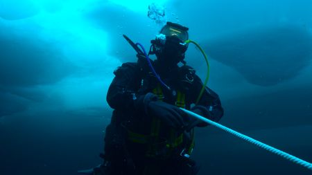 Will Smith diving under the ice near the North Pole. (credit: National Geographic)