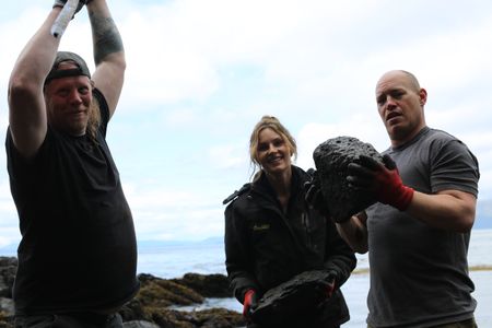 David Squibb, Sarah McDonald, and Troy Brockway construct a ramp from the beach up to Troy's property. (National Geographic/Gil Cano)