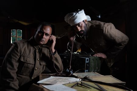 Captain Anis Khan and medic Siddiq Ahmed (played by Shammi Aulakh and Rishi Rian, respectively) are pictured in a scene of a WW2 reenactment production for "Erased: WW2's Heroes of Color." Captain Anis Khan and medic Siddiq Ahmed were members of Force K6, a little-known Indian regiment of mule handlers in WW2. Amidst the chaos of Dunkirk and the advancing German Army, the Indian regiment fought for victory and independence. (National Geographic/Harriet Laws Herd)