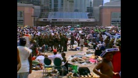 Crowds of stranded residents and National Guardsmen gather outside the Superdome following Hurricane Katrina in 2005.  (ABC News)