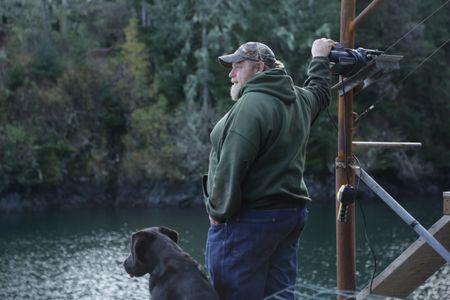 Tim 'Curly' Leach uses a hoist to get a deer up to his property. (National Geographic/Mickey Ramos)