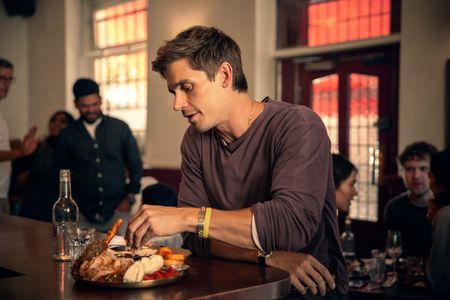 Antoni Porowski tries the Sunday roast at the Tamil Crown in London. (National Geographic/Richard Ing)