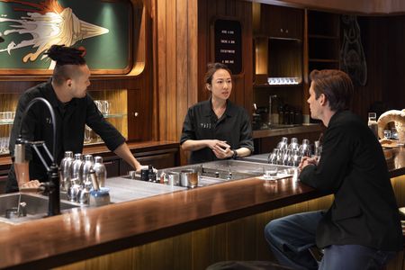 GN and Faye, owners and co-founders of Double Chicken Please, meet with Antoni Porowski at their bar. (National Geographic/Jose Alvarado Jr.)