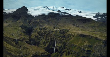 A glacial tongue behind a waterfall.   (credit: National Geographic)