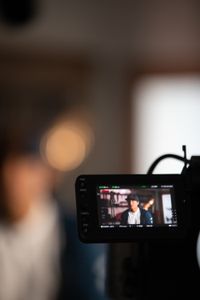 The camera monitor shows  filmmaker and climber Jimmy Chin during his interview.  (photo credit: National Geographic/Teague Wasserman)